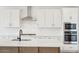 Modern kitchen with quartz countertops, stainless steel appliances, and a stylish faucet at 26361 N 76Th Dr, Peoria, AZ 85383