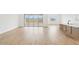 Inviting living room features wood-look floors, abundant natural light, and seamless access to the backyard at 26361 N 76Th Dr, Peoria, AZ 85383