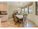 Bright dining room featuring a marble-topped table and large windows showcasing desert views at 27502 N Azatlan Dr, Rio Verde, AZ 85263