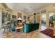 Living room with views, fireplace, tile floor, and adjacent access to outdoor space at 27502 N Azatlan Dr, Rio Verde, AZ 85263