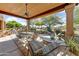 Spacious covered patio with desert landscaping, seating areas, and scenic views at 27502 N Azatlan Dr, Rio Verde, AZ 85263