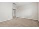 Bedroom featuring neutral tones, soft carpeting, and a ceiling fan at 2820 E Tracy Ln # 1, Phoenix, AZ 85032