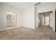 Spacious bedroom with plush carpeting, ensuite bathroom, and lots of natural light at 2820 E Tracy Ln # 1, Phoenix, AZ 85032