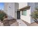 A close up of the exterior of the townhome highlighting the front door and walkway at 2820 E Tracy Ln # 1, Phoenix, AZ 85032