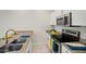 Bright kitchen with stainless steel appliances, granite counters, and ample cabinet space at 2820 E Tracy Ln # 1, Phoenix, AZ 85032