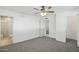 Bedroom with a bathroom, neutral carpet, a ceiling fan and white trim at 2935 W Dailey St, Phoenix, AZ 85053