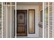 Inviting entryway showcases a custom wood door with decorative hardware and sidelight at 2935 W Dailey St, Phoenix, AZ 85053