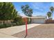 Charming single-story home with lush landscaping, a two-car garage, and a welcoming driveway at 2935 W Dailey St, Phoenix, AZ 85053