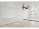 Spacious living room featuring neutral walls, tile flooring, recessed lighting, and ceiling fans at 2935 W Dailey St, Phoenix, AZ 85053