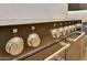 Close up of a black oven with chrome knobs and handles, showcasing its sleek design and modern features at 29617 W Eagle Dr, Palo Verde, AZ 85343