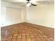 Bright living room featuring tile flooring and a ceiling fan at 313 W Palomino Dr, Chandler, AZ 85225