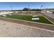 Community cornhole with benches at 36805 W San Clemente St, Maricopa, AZ 85138