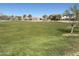 Expansive green community park with soccer net and neighborhood homes in the background at 36805 W San Clemente St, Maricopa, AZ 85138