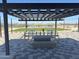 Community grilling area featuring stone picnic table and built in grills at 36805 W San Clemente St, Maricopa, AZ 85138
