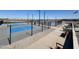 View of the community pickleball court surrounded by black fencing at 36805 W San Clemente St, Maricopa, AZ 85138