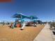 Shaded community playground with multiple slides and play areas at 36805 W San Clemente St, Maricopa, AZ 85138