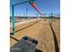 Community playground with colorful play structures and wood chip ground cover at 36805 W San Clemente St, Maricopa, AZ 85138