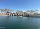 A community pond features walking paths and shaded picnic area at 36805 W San Clemente St, Maricopa, AZ 85138