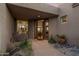 Exterior view of the home's front entrance showcasing a tiled walkway and desert landscaping at 38951 N 101St Way, Scottsdale, AZ 85262