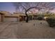 Exterior view of a single story home featuring desert landscaping and a winding driveway at 38951 N 101St Way, Scottsdale, AZ 85262