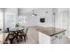 Modern eat-in kitchen featuring granite countertops and an open layout to the living area at 4411 E Lone Cactus Dr, Phoenix, AZ 85050