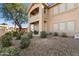 Exterior features a patio, desert landscaping and second story balcony on an upscale home at 5450 E Mclellan Rd # 133, Mesa, AZ 85205