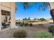 Home's landscaped backyard overlooks the lush greenery of the golf course at 5450 E Mclellan Rd # 133, Mesa, AZ 85205