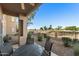 A covered patio overlooks the lush greenery of the golf course, and desert landscaping at 5450 E Mclellan Rd # 133, Mesa, AZ 85205