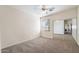 Well-lit bedroom features carpet, neutral paint, and a large window for natural light at 5450 E Mclellan Rd # 133, Mesa, AZ 85205