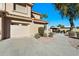 Charming two-story home with desert landscaping, a tile roof, and an attached two-car garage at 5450 E Mclellan Rd # 133, Mesa, AZ 85205