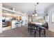 Open-concept living area with a breakfast bar and adjacent dining space; light and airy at 5450 E Mclellan Rd # 133, Mesa, AZ 85205