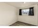 Bright bedroom featuring modern wood-look flooring at 5601 W Missouri Ave # 2, Glendale, AZ 85301