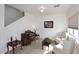 Cozy living room with staircase and large windows at 5608 E Lush Vista Vw, Florence, AZ 85132