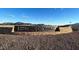 Estrella Crossing community entrance with stone signage and mountain views in the background at 5828 W Willow Ridge Dr, Laveen, AZ 85339
