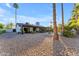 A spacious backyard showcasing desert landscaping and a covered patio perfect for outdoor living at 5916 E Hearn Rd, Scottsdale, AZ 85254