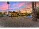 Backyard featuring a well-manicured landscape, covered patio, and a refreshing pool at 5916 E Hearn Rd, Scottsdale, AZ 85254