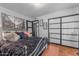 This bedroom includes decorative lighting, a sliding-door closet, and an interesting metal frame bed at 5916 E Hearn Rd, Scottsdale, AZ 85254