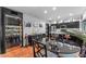 Stylish dining area with a modern table setting and wine room in view at 5916 E Hearn Rd, Scottsdale, AZ 85254