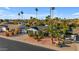 Aerial view of a home with desert landscaping, a driveway, and tall palm trees at 5916 E Hearn Rd, Scottsdale, AZ 85254