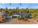 Exterior view of a charming home featuring a well-manicured front yard with desert landscaping at 5916 E Hearn Rd, Scottsdale, AZ 85254