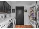 Well-equipped laundry room features modern appliances and ample storage shelves at 5916 E Hearn Rd, Scottsdale, AZ 85254