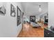An open living room boasts tile floors, a fireplace, modern decor, and bar seating at 5916 E Hearn Rd, Scottsdale, AZ 85254