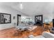 Spacious living room with tile flooring, fireplace, and modern furniture arrangement at 5916 E Hearn Rd, Scottsdale, AZ 85254