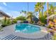 Backyard pool with lounge chairs, landscaping, and a decorative patio umbrella at 5916 E Hearn Rd, Scottsdale, AZ 85254