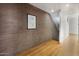 Hallway with hardwood floors, brick wall and art at 620 N 4Th Ave # 2, Phoenix, AZ 85003