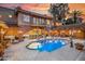 Beautiful backyard with a pool, covered patios, a fountain, and an attached game room at 7155 E Oakmont Dr, Paradise Valley, AZ 85253