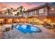 Resort-style pool with covered patio and outdoor living spaces, ideal for entertaining at 7155 E Oakmont Dr, Paradise Valley, AZ 85253
