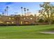 Well-maintained home featuring a vast lawn and landscaped yard overlooking the golf course at 7155 E Oakmont Dr, Paradise Valley, AZ 85253