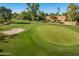 Aerial view of golf course with mature trees and views of the surrounding community at 7155 E Oakmont Dr, Paradise Valley, AZ 85253