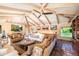 Bright living room with vaulted ceilings, ceiling fan, and comfortable seating area at 7155 E Oakmont Dr, Paradise Valley, AZ 85253